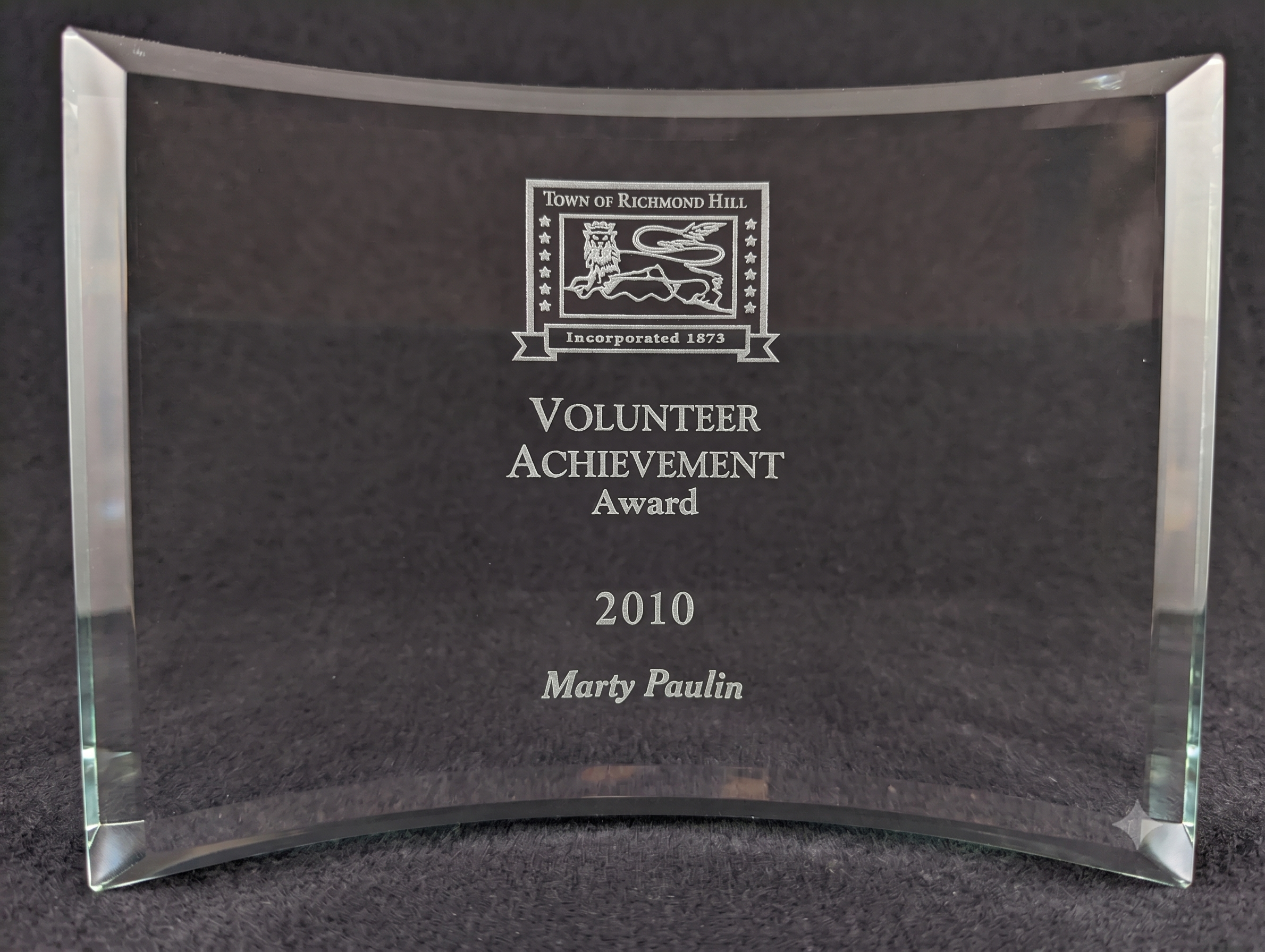 Marty Paulin holding the Richmond Hill Volunteer Achievement Award certificate